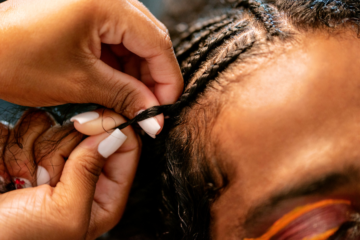 Man with Curly Hair Getting Braids